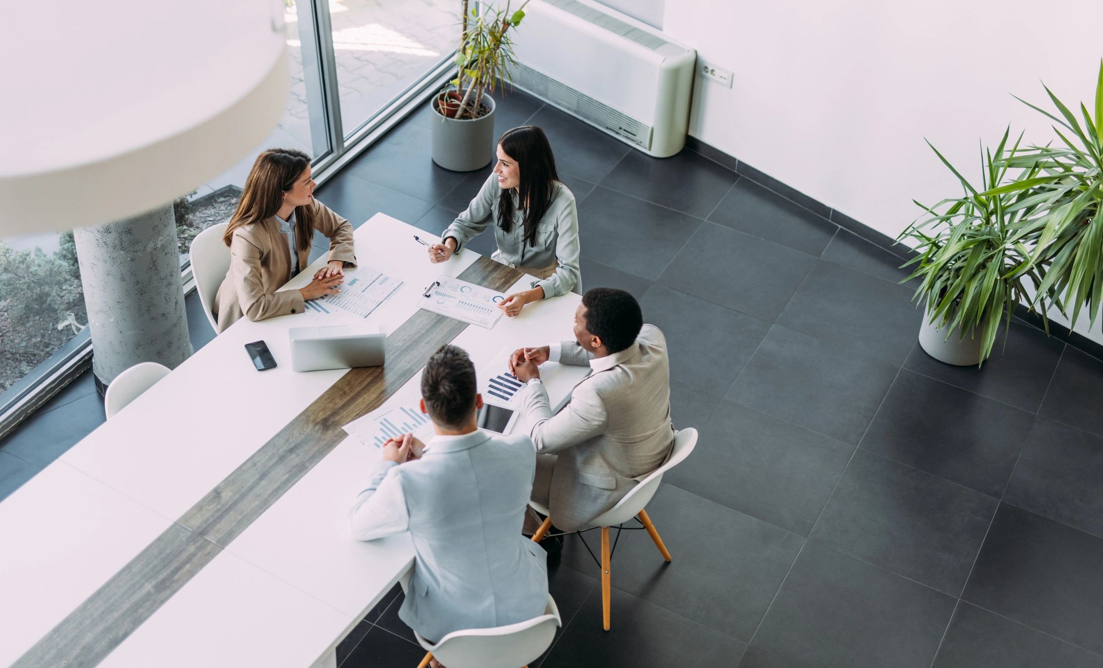 Business team meeting in an office discussing compliance matters