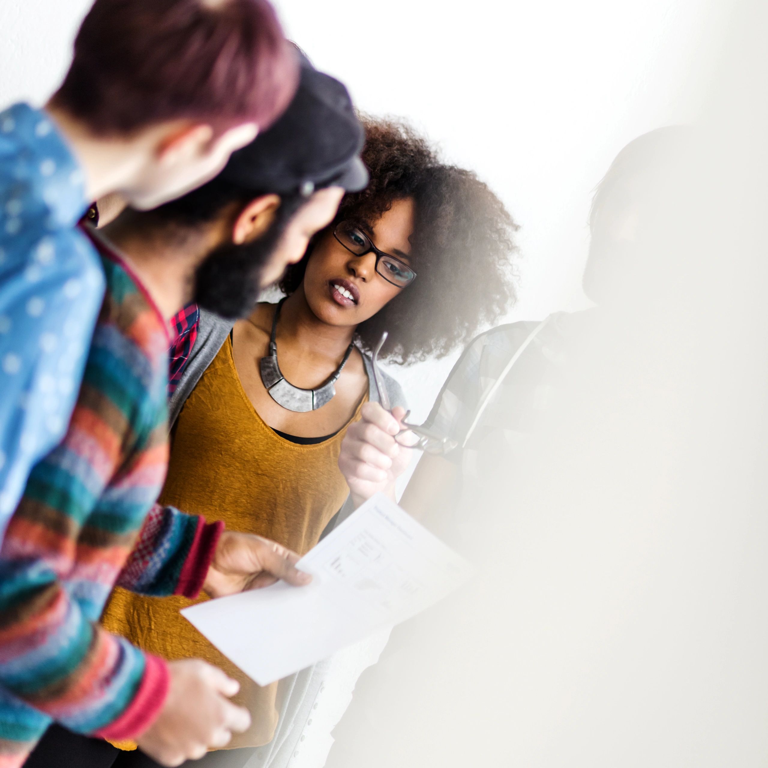 Black female consultant leading a client discussion in a modern office